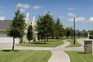 Cottages lined up with a curving sidewalk connecting them