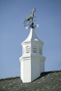 Weather vane with horse on top