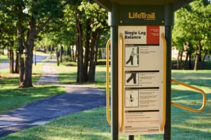 Single leg balance signage on walking trail